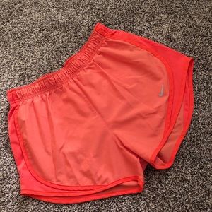 Light orange Nike running shorts